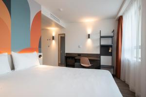 Postel nebo postele na pokoji v ubytování B&B HOTEL Mechelen
