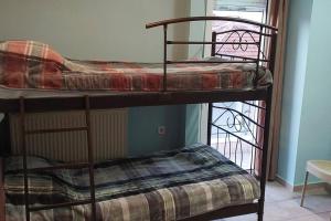 a couple of bunk beds in a room at Νώε in Perístasis
