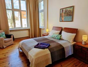 En eller flere senge i et værelse på Apartament Bryza przy molo, parku i placu zabaw