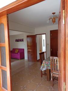 a living room with a table and a couch at Los Jazmines in San Salvador de Jujuy