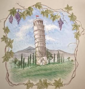 a drawing of a lighthouse in areath of grapes at Dal Ciandri in Pisa