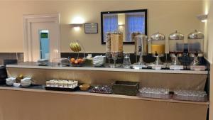 a counter in a hotel room with food on it at Royal Grosvenor Hotel in Weston-super-Mare
