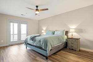a bedroom with a bed and a ceiling fan at Nacoochee in Helen