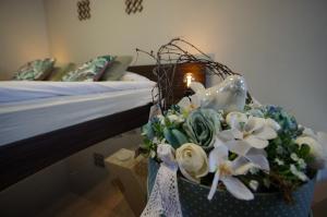 A bed or beds in a room at Paradiso Apartmanház