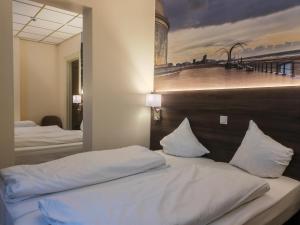 Postel nebo postele na pokoji v ubytování Hotel Albert II Oostende
