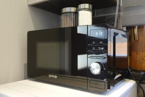 A kitchen or kitchenette at Paradiso Apartmanház
