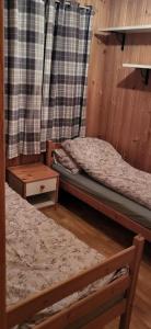 a room with two bunk beds and a table at Leilighet på gård in Sauland