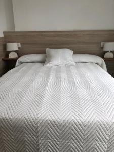 Postel nebo postele na pokoji v ubytování Apartamentos Corcubión