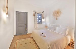 Postel nebo postele na pokoji v ubytování Riad Amya & Spa