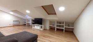 Un televizor și/sau centru de divertisment la Casa Tarrazo II