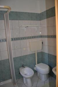 a bathroom with a toilet and a sink at Casa Vacanze da Giuseppina in Lampedusa