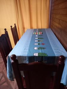 a table with a blue table cloth on it at Departamento LA LILI in Uspallata