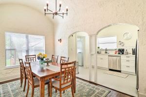 a kitchen and dining room with a table and chairs at Stunning Jacksonville Getaway with Backyard! in Jacksonville