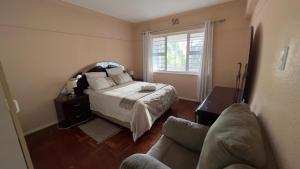 מיטה או מיטות בחדר ב-Rio Guest Accommodation