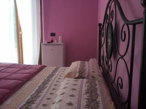 En eller flere senger på et rom på B&B Il Giardino Mediterraneo