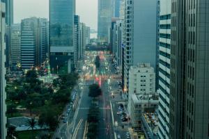 a view of a busy city street with buildings at TRYP by Wyndham Abu Dhabi City Center in Abu Dhabi
