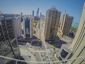 a view of a city with tall buildings and traffic at TRYP by Wyndham Abu Dhabi City Center in Abu Dhabi