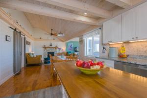 a kitchen with a bowl of fruit on a table at 277 Phillips Road Sandwich - Cape Cod in Sagamore Beach