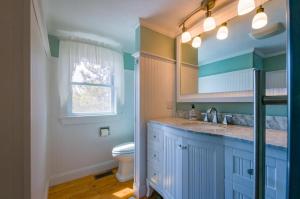 a bathroom with a sink and a toilet at 277 Phillips Road Sandwich - Cape Cod in Sagamore Beach +38 photos