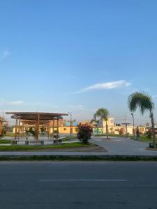 a parking lot with a pavilion and a street at Makai - Nayarak Paracas in Paracas