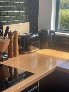a wooden counter top with a coffee maker on it at Shibui Lilydale Luxury Romance in Lilydale