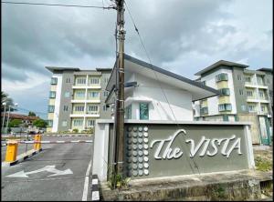 a building with the words the usa painted on it at The Vista Apartment @ Demak Laut in Kuching