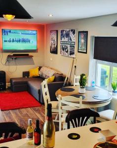 a living room with a couch and a table at Atlantic Coast Lodge in Spanish Point