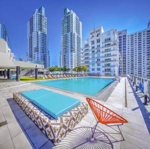 a swimming pool in a city with tall buildings at Experience the perfect Miami Life!! Centrally located Luxury Condo! in Miami