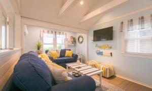 a living room with a blue couch and a table at 131 #4 North Shore Boulevard East Sandwich - Waters Edge #4 in East Sandwich