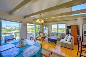 a living room with a bed and a dining room at 123 Salt Marsh Road East Sandwich - - Cape Cod in East Sandwich