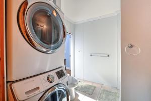 a washer and dryer in a small bathroom at 10 Chadwell Avenue Sandwich - Cape Cod in Sandwich