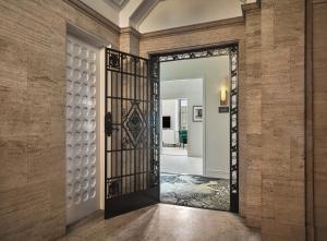 an open door into a room with a brick wall at Pendry Chicago in Chicago