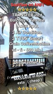 un cartello per un ristorante con panchina e albero di DELUXE SeaView-SUNSETS !TRANSFE-R inc! POOL,2AirCond,2TV65",600Mb Dishwasher,,2 BEACHes,ANFI-view a Patalavaca