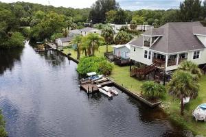 an aerial view of a house on a river at 4BR Private Dock, Warm Spring Canal, Kayaks, Canoe in Hudson