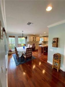 a dining room and kitchen with a table and chairs at 4BR Private Dock, Warm Spring Canal, Kayaks, Canoe in Hudson