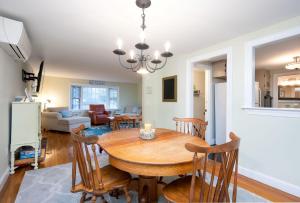 a dining room and living room with a table and chairs at 177 Old Stage Road Centerville - - Family Tides in Centerville