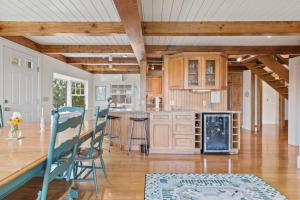 a kitchen with wooden cabinets and a wooden table at 7 Sunrise Lane Sandwich Cape Cod - - Sunrise Vista in Sandwich