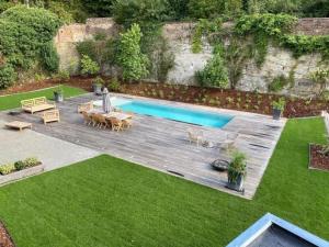 an overhead view of a backyard with a swimming pool at Welcoming holiday home in Dison with private pool in Dison