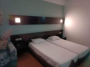 A bed or beds in a room at Bellissimo appartamento vista mare sulla piscina