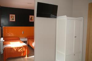 Posteľ alebo postele v izbe v ubytovaní Hostal Vintage Santander