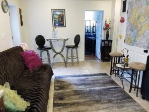 a living room with a couch and a table at Private Retreat Apartment in DC in Washington, D.C.