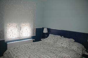 Posteľ alebo postele v izbe v ubytovaní Hostal Vintage Santander