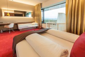 Un ou plusieurs lits dans un hébergement de l'établissement Airport Hotel Basel - Convenient & Friendly