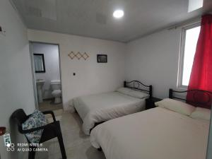 Postel nebo postele na pokoji v ubytování Casa turística Santa Helena y el Danubio