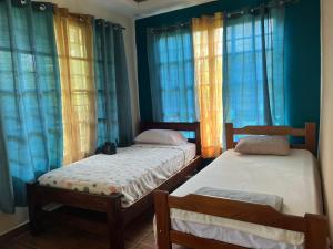 Katil atau katil-katil dalam bilik di HOTEL Ecológico BLUEROCK