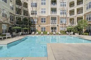 a large swimming pool in front of a building at Atlanta Luxurious Apartment in Atlanta