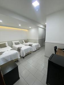 Postel nebo postele na pokoji v ubytování Hotel Caiçara