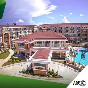 a rendering of a large building with a swimming pool at Arezzo Condo Staycation in Davao City