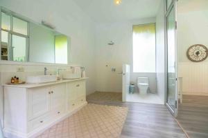 a bathroom with a sink and a shower and a toilet at Koh Phangan luxurious pool and garden villa in Haad Rin