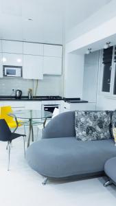 a living room with a couch and a glass table at Апартаменты с шикарным видом на море in Aktau